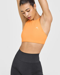 EasyLift™ High Neck Sports Bra with White Logo | Powdered Orange