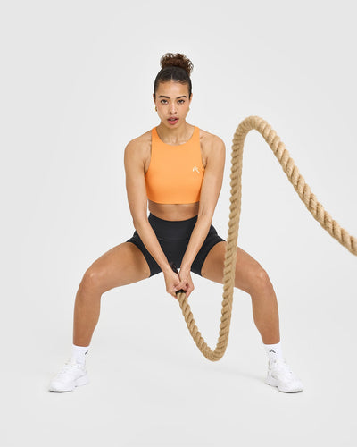EasyLift™ High Neck Sports Bra with White Logo | Powdered Orange