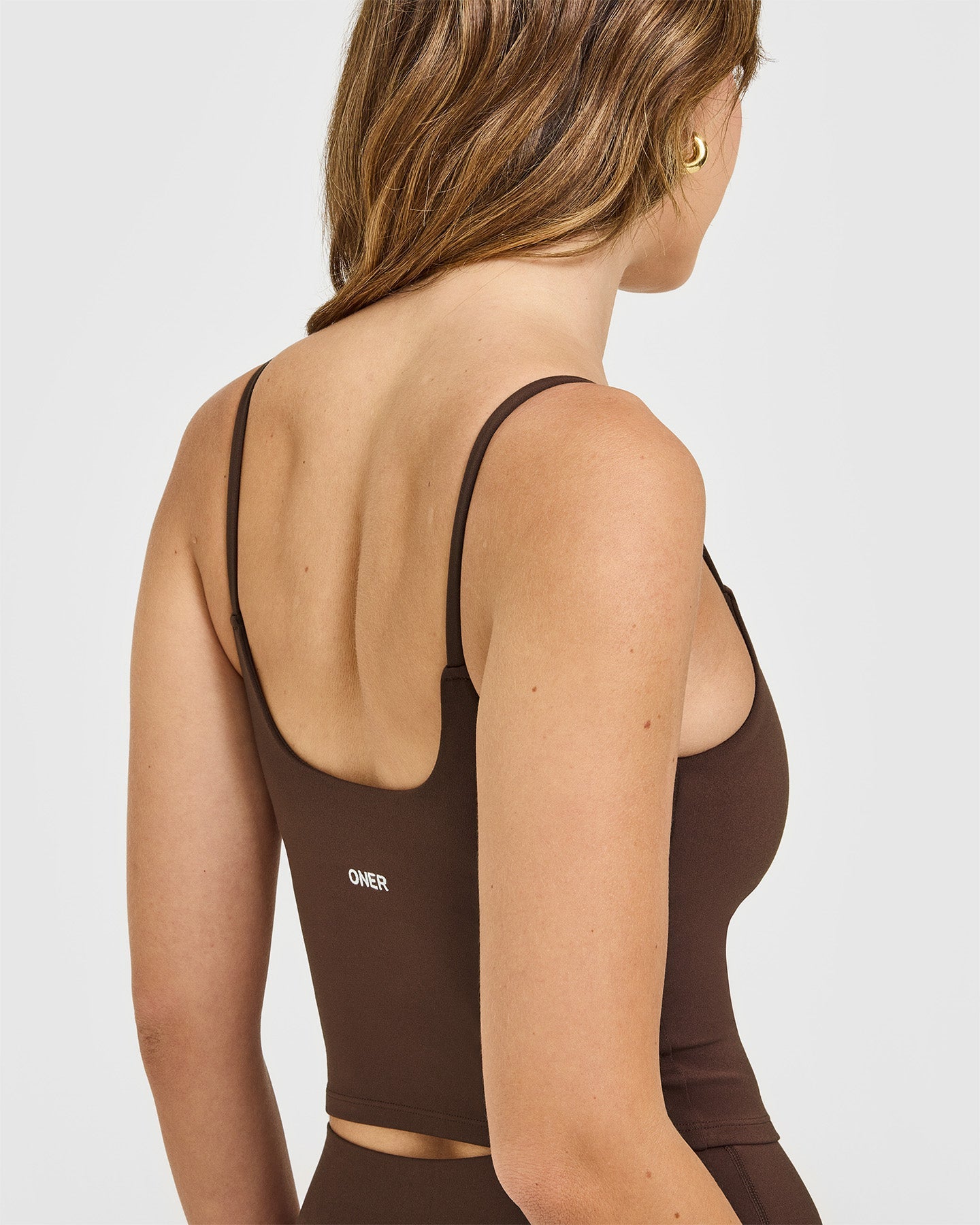 SoftMotion™ Strappy Mid Vest with Built in Bra Shelf with White Logo | Espresso Brown