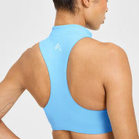 EasyLift™ Zip High Neck Sports Bra with White Logo | Arctic Blue