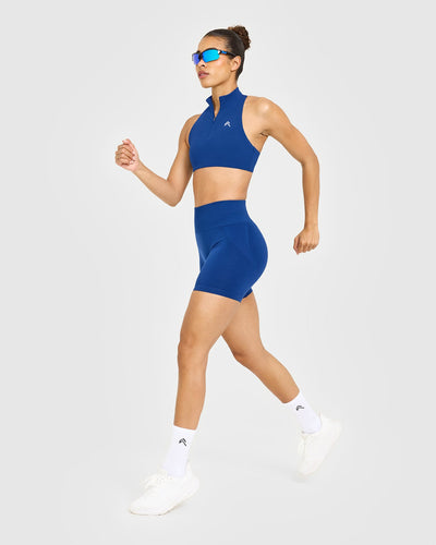 EasyLift™ Zip High Neck Sports Bra with White Logo | Vintage Navy