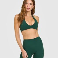 SoftMotion™ Minimal Halter Neck Bralette with White Logo | Dark Racing Green