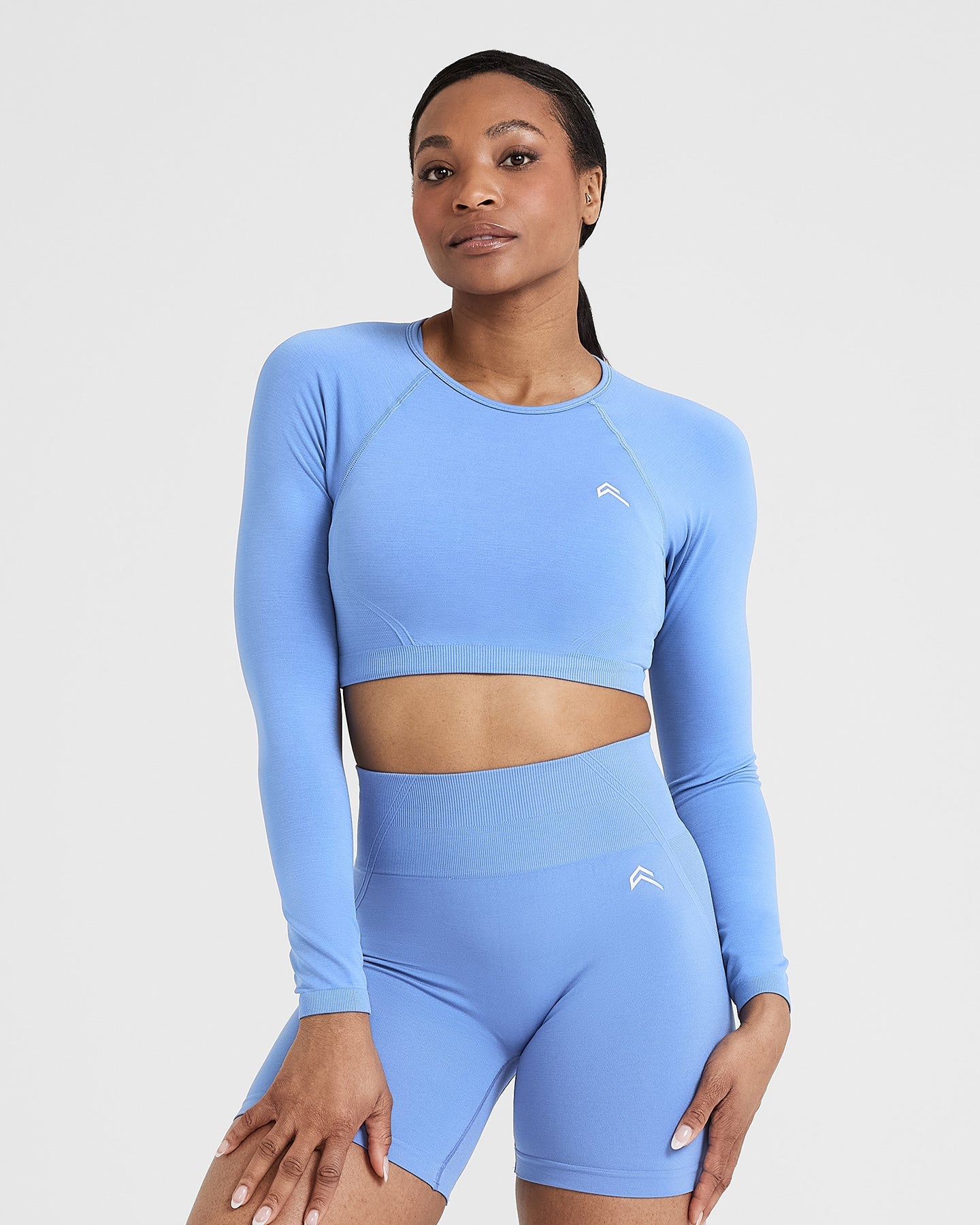 Effortless Seamless Long Sleeve Crop Top with White Logo | Light Denim