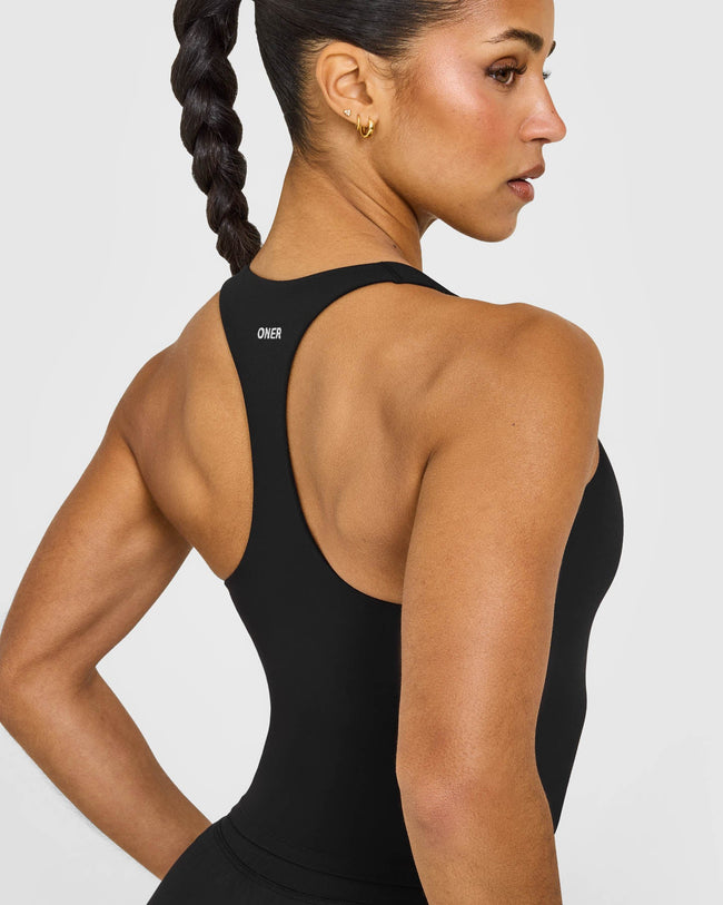 SoftMotion™ Racer Back Mid Vest with Built in Bra Shelf with White Logo | Black