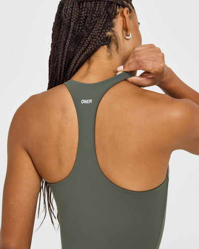 SoftMotion™ Racer Back Mid Vest with Built in Bra Shelf with White Logo | Dark Khaki