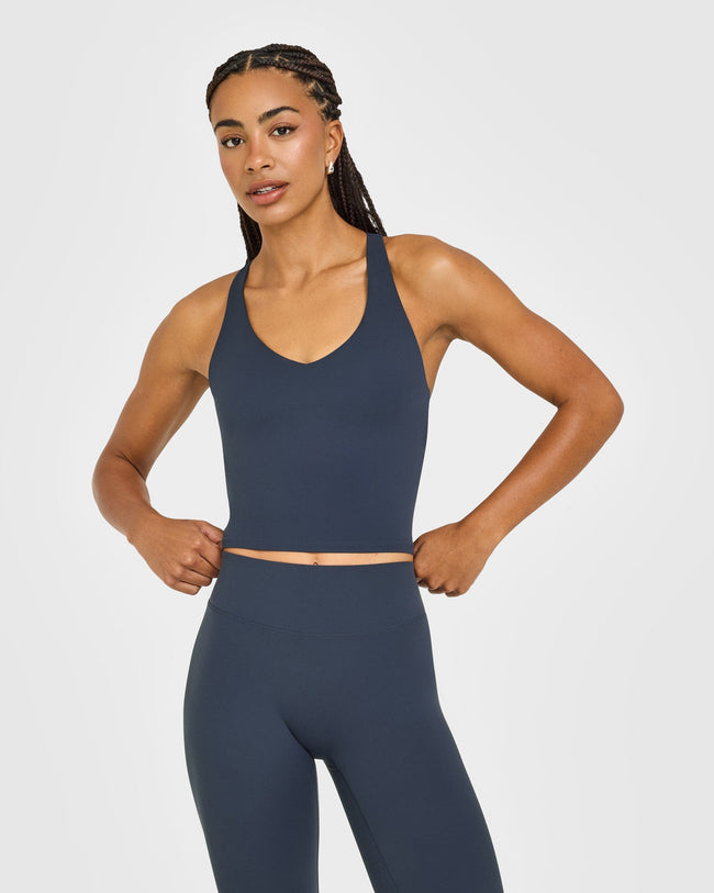 SoftMotion™ Racer Back Mid Vest with Built in Bra Shelf with White Logo | True Blue