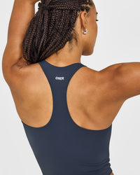SoftMotion™ Racer Back Mid Vest with Built in Bra Shelf with White Logo | True Blue