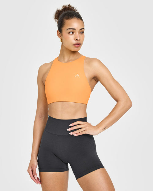 Oner Modal EasyLift™ High Neck Sports Bra with White Logo | Powdered Orange