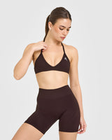 EnhanceLift™ Seamless Minimal Halter Neck Bralette with White Logo | Plum Brown