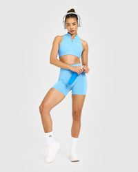 EasyLift™ Zip High Neck Sports Bra with White Logo | Arctic Blue