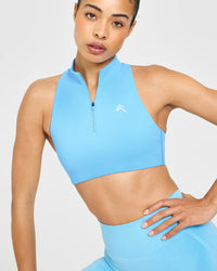 EasyLift™ Zip High Neck Sports Bra with White Logo | Arctic Blue