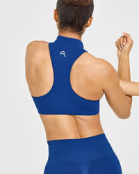 EasyLift™ Zip High Neck Sports Bra with White Logo | Vintage Navy
