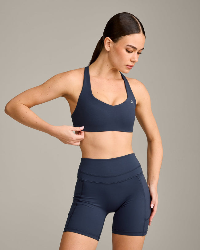 EasyLift™ Cross Back Sports Bra with Grey Logo | True Blue