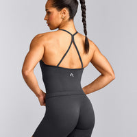 EnhanceLift™ Seamless Strappy Racer Tank Top with Built in Bra Shelf with Grey Logo | Coal