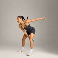 EnhanceLift™ Seamless Strappy Racer Vest with Built in Bra Shelf with Grey Logo | Coal
