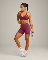 EnhanceLift™ Seamless Strappy Sports Bra with Grey Logo | Burnt Maroon