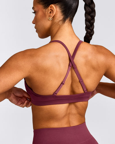 EnhanceLift™ Seamless Strappy Sports Bra with Grey Logo | Burnt Maroon
