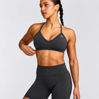 EnhanceLift™ Seamless Strappy Sports Bra with Grey Logo | Coal