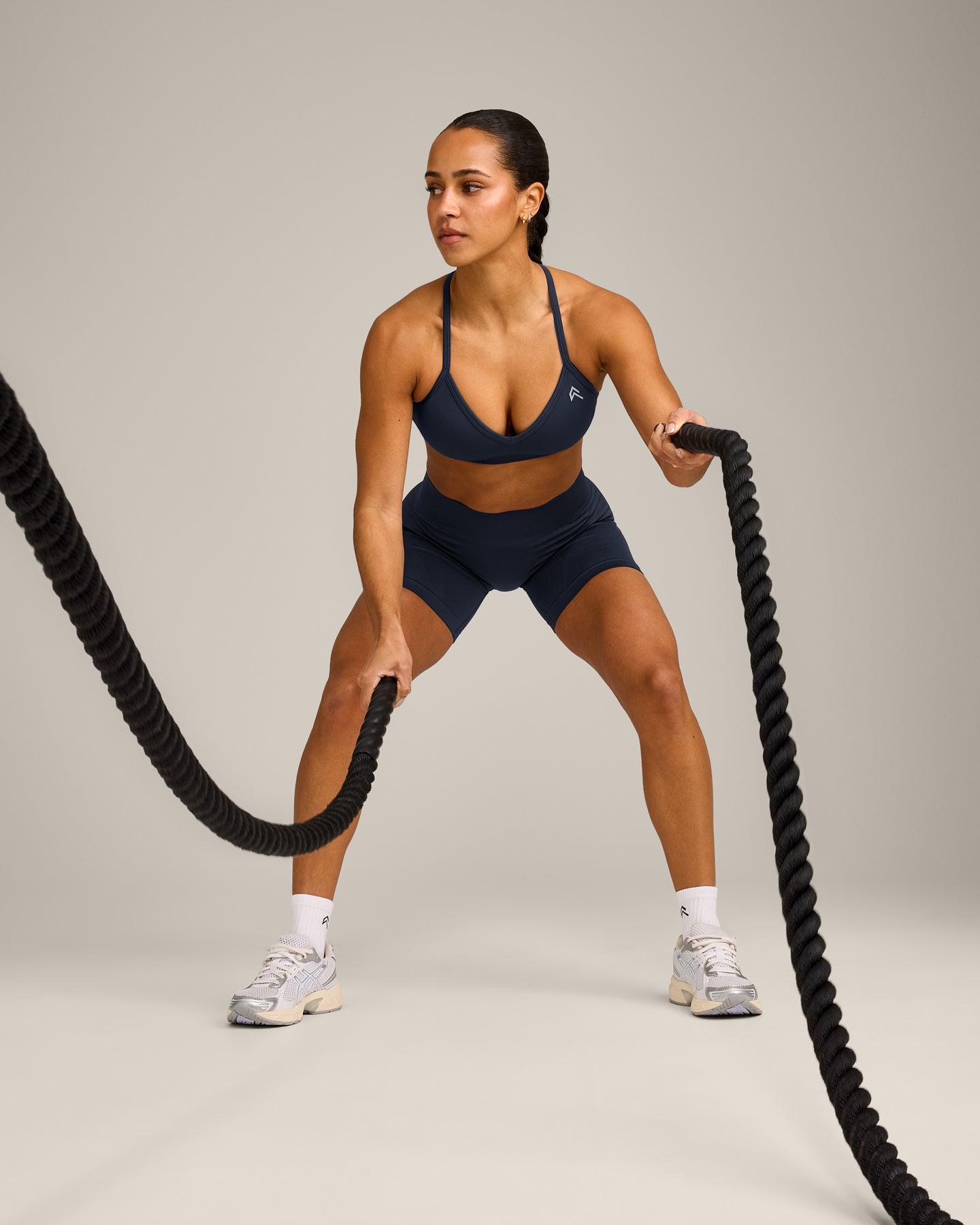 EnhanceLift™ Seamless Strappy Sports Bra with Grey Logo | True Blue