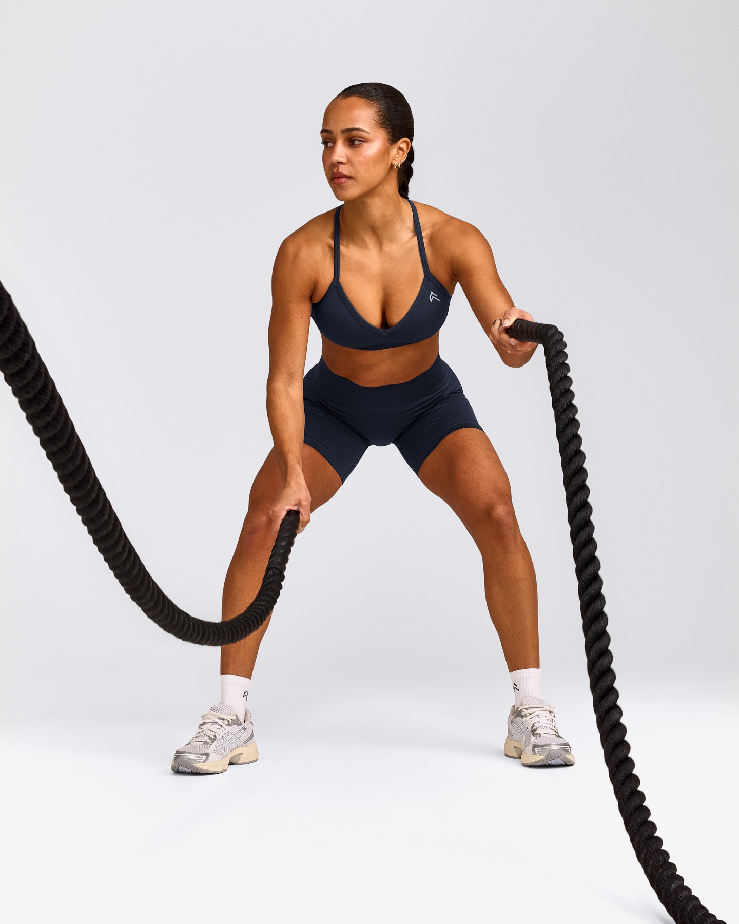 EnhanceLift™ Seamless Strappy Sports Bra with Grey Logo | True Blue