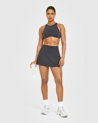 SoftMotion™ High Neck Sports Bra with White Logo | Coal