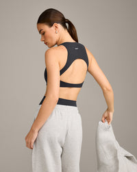 SoftMotion™ High Neck Sports Bra with Grey Logo | Coal