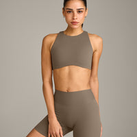 SoftMotion™ High Neck Sports Bra with Grey Logo | Moss Brown