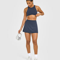 SoftMotion™ High Neck Sports Bra with White Logo | True Blue