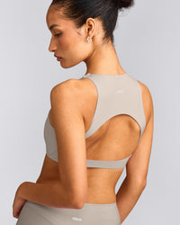SoftMotion™ High Neck Sports Bra with White Logo | Warm Sand
