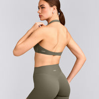 SoftMotion™ Minimal Halter Neck Bralette with Grey Logo | Alpine Green