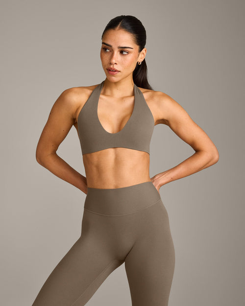 SoftMotion™ Minimal Halter Neck Bralette with Grey Logo | Moss Brown