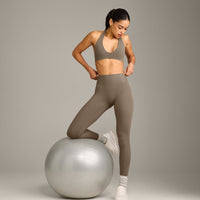 SoftMotion™ Minimal Halter Neck Bralette with Grey Logo | Moss Brown