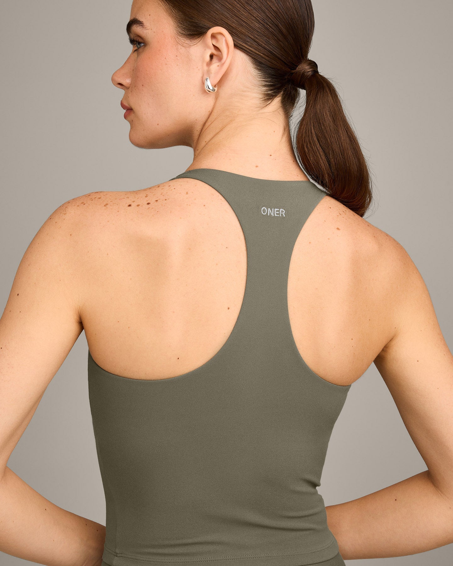 SoftMotion™ Racer Back Mid Vest with Built in Bra Shelf with Grey Logo | Alpine Green