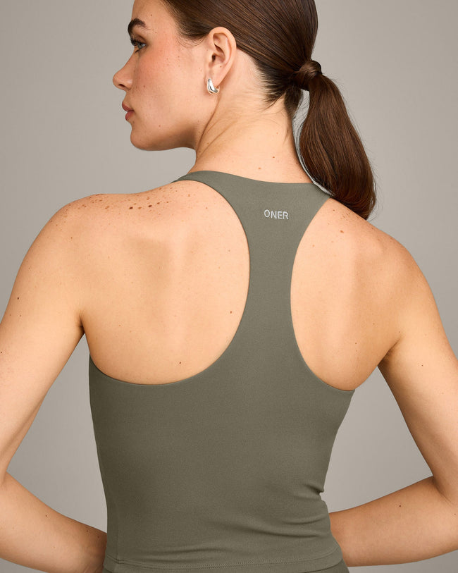 SoftMotion™ Racer Back Mid Vest with Built in Bra Shelf with Grey Logo | Alpine Green