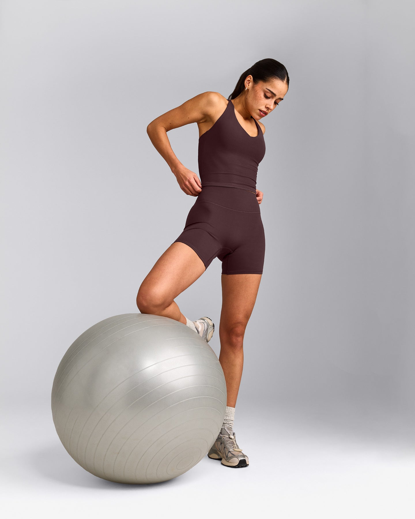 SoftMotion™ Racer Back Mid Tank Top with Built in Bra Shelf with Grey Logo | Plum Brown