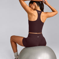 SoftMotion™ Racer Back Mid Tank Top with Built in Bra Shelf with Grey Logo | Plum Brown