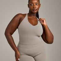 SoftMotion™ Racer Back Mid Vest with Built in Bra Shelf with White Logo | Warm Sand