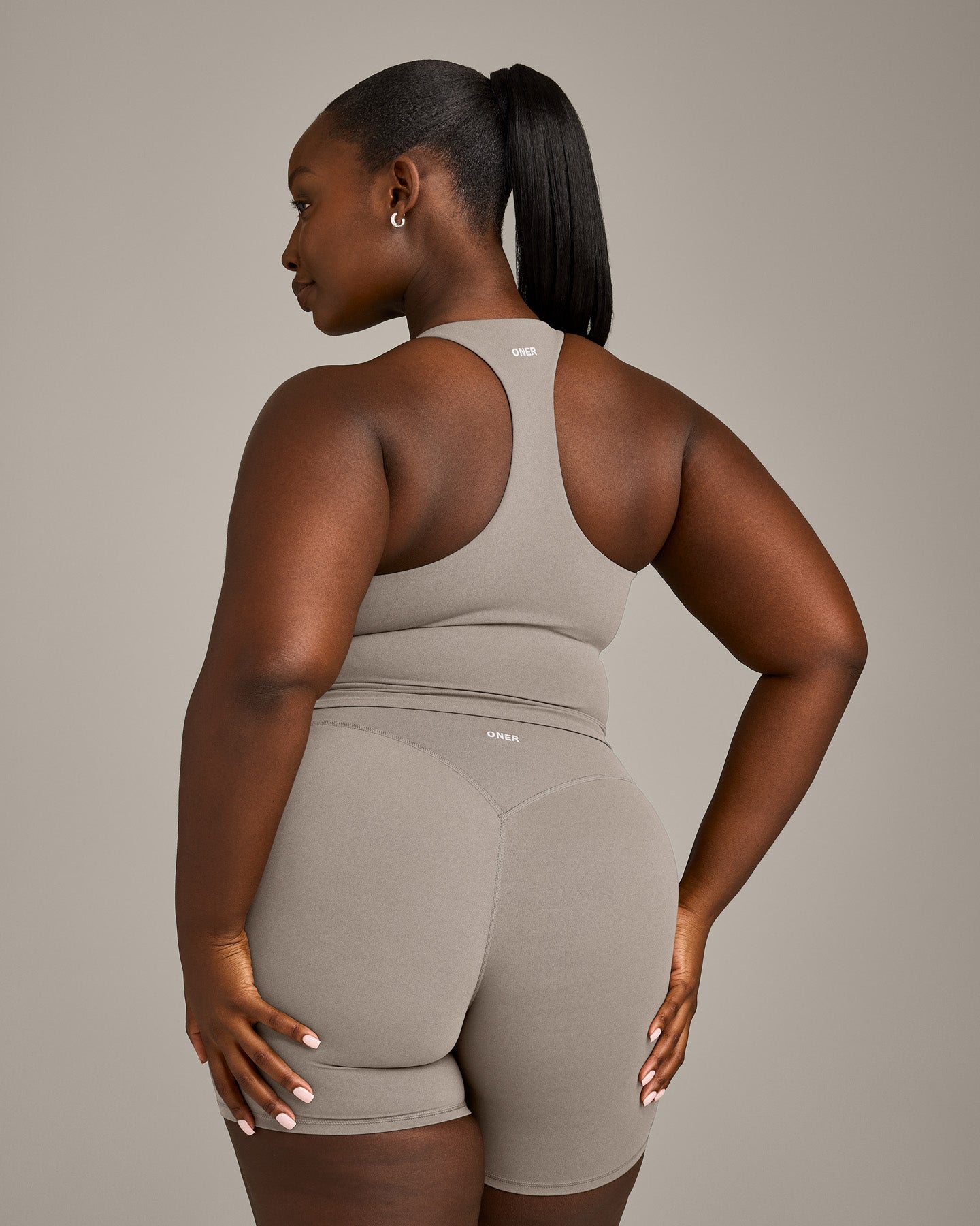 SoftMotion™ Racer Back Mid Vest with Built in Bra Shelf with White Logo | Warm Sand