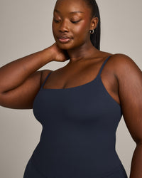 SoftMotion™ Strappy Mid Vest with Built in Bra Shelf with Grey Logo | True Blue