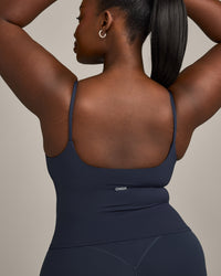 SoftMotion™ Strappy Mid Vest with Built in Bra Shelf with Grey Logo | True Blue