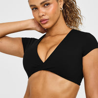 Unified Twist Front Short Sleeve Crop Top White Logo | Black
