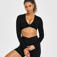 Unified Twist Front Long Sleeve Crop Top White Logo | Black