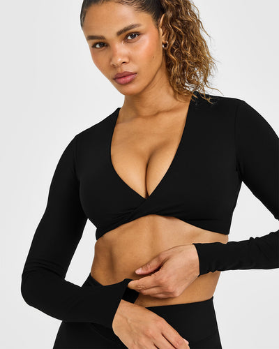 Unified Twist Front Long Sleeve Crop Top White Logo | Black