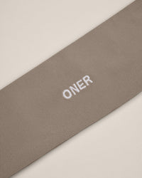 SoftMotion™ Headband with White Logo | Warm Sand