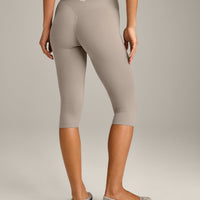 SoftMotion™ High Waisted Capri Leggings with White Logo | Warm Sand