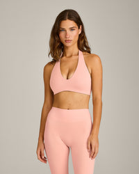 SoftMotion™ Minimal Halter Neck Bralette with Grey Logo | Peach Orange