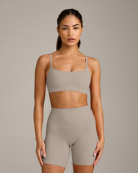 SoftMotion™ Strappy Sports Bra with White Logo | Warm Sand