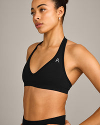 EffortlessLift™ Seamless Halter Neck Sports Bra with Grey Logo | Black
