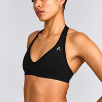 EffortlessLift™ Seamless Halter Neck Sports Bra with Grey Logo | Black