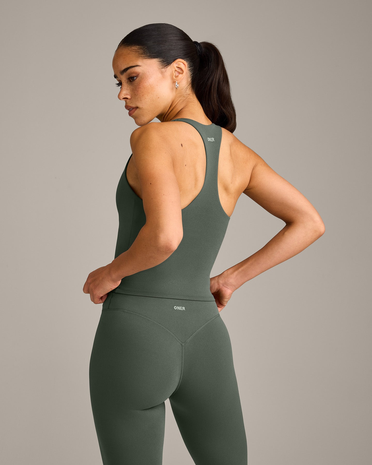 SoftMotion™ Racer Back Mid Vest with Built in Bra Shelf with Grey Logo | Dark Khaki